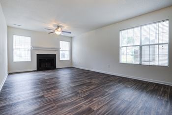 Living room with wooden floors and fireplace